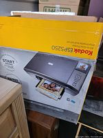 Original retail box of Kodak ESP5250 printer showing product image and details.