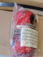 Front view of the Mothers Carpet Upholster Brush in sealed plastic packaging showing branding and warnings.