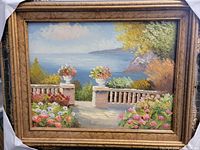 Frontal image of the oil on canvas painting showing detailed garden, flowers, ocean, and mountains, with original frame.