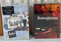 Photo showing both boxed sets side by side with visible shrink wrap seal intact, confirming new condition.