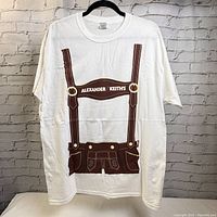 Front view of white t-shirt with printed lederhosen design and Alexander Keith's logo.