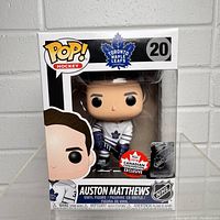 Front view of 2018 Auston Matthews Funko POP hockey vinyl figure in original box with Canadian Convention exclusive sticker visible.