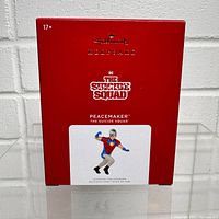 Red box with Hallmark Keepsake branding, PeaceMaker from The Suicide Squad shown on front with age 17+ recommendation.