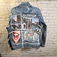 Back of denim jacket showing photographic patches and 'jeunessee' text