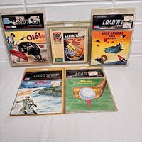 All five vintage Commodore games arranged neatly, showing front cover art and packaging.