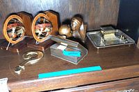 Photo showing entire desk accessory lot with bookends, question mark paperweight, bronze bookend, and metal inkstand