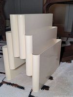 Front side view showing three wave-shaped plastic compartments