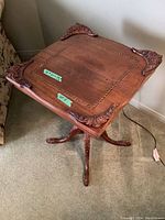 Top view showing carved corner appliques and inlay border