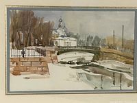 Full view of the framed watercolour painting depicting a winter landscape scene with bridge and church in the background.