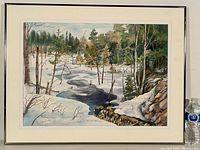 Framed watercolour painting of a snowy forest landscape with a creek flowing through it.