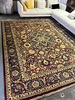 Full view of carpet laid out beneath sectional sofa