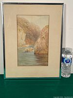 Full framed antique watercolour painting by Fleetwood Varley with a water bottle beside for size reference.