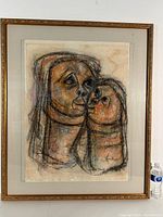 Full view of framed pastel painting showing two stylized faces close together, signed by artist A. Maseko at bottom right.