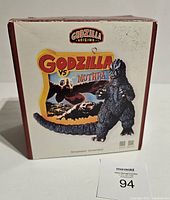 Front of the original box showing Godzilla figure and 'Godzilla vs Mothra' artwork on ornament.