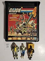 GI Joe Official Collector Display Case with three action figures underneath