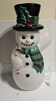 Snowman blow mold shown from front with no illumination, displaying painted features and accessories