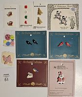 Full lot showing various novelty buttons including hand-painted and themed buttons packed on cards and loose in small bag.