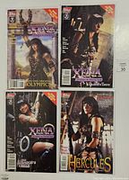 Photo showing all four comic books lying on a surface, with covers visible.