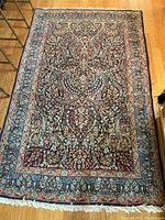 Full view of entire carpet laid flat on hardwood floor