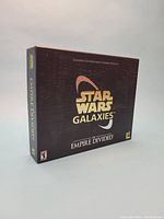 Front view of the Star Wars Galaxies Empire Divided boxed set showing logo and design details.