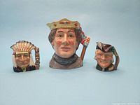 Front view of 3 Royal Doulton Toby mugs showing detailed hand-painted faces including King Henry V, Robin Hood, and North American Indian.