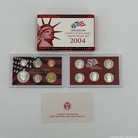 2004 United States Mint Silver Proof Set with original box, two plastic cases containing coins, and certificate of authenticity card.