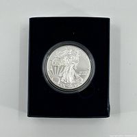 Front view of the 2016 American Eagle silver coin housed in a black display box.
