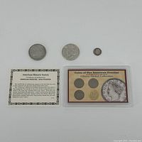 Photo showing the Liberty Nickels in collectible holder with certificate and three other coins.
