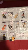 Lot of 10 Lego minifigures individually bagged, featuring Star Wars, The Lego Movie, and Lego Batman Movie characters.