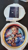 Star Trek talking collector plate with picture of the original series cast in colorful design, displayed inside foam protective packaging.