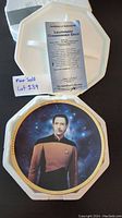 Photo showing collectible plate of Lieutenant Commander Data from Star Trek TNG with certificate of authenticity inside the original presentation box.