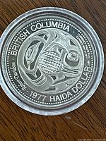 Obverse side of coin showing traditional Haida design and inscriptions 'British Columbia 1977 Haida Dollar'