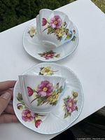 Two Shelley Begonia cups and saucers displayed from the top showing floral pattern on cups and saucers.