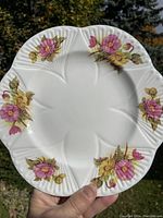 Front view of 9.25 inch Shelley fine bone china begonia dinner plate showing floral pattern and scalloped edges.