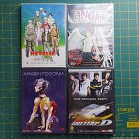 Front covers of 4 anime DVDs showing their artwork and titles Metallo, Angel Sanctuary, Argentosoma, and Initial D.