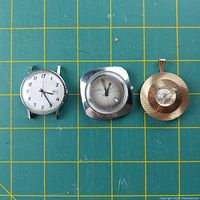 Three mechanical watches: a round white dial watch, a square ZIM watch, and a gold-tone round pendant watch with white dial.