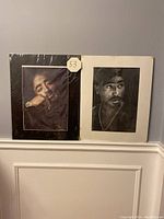 Two Tupac Shakur portrait prints side-by-side, showing overall size and condition sealed in plastic wrap.