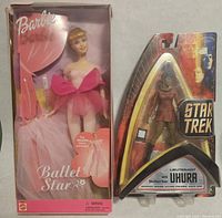 Front view of Barbie Ballet Star doll in original box and Star Trek Lt. Uhura action figure in original packaging