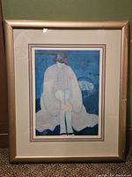 Frontal image of the framed print showing the artwork and frame condition.