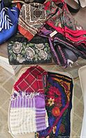 Lot containing vintage beaded purse with floral beadwork and assorted vintage scarves in various colors and patterns