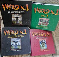 Four Weird books laid flat: Weird N.J. volumes 1 and 2, Weird U.S., and one with damage to bottom left corner.