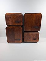 Front view of four wooden canisters labeled Coffee, Flour, Tea, and Sugar.