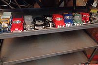 Full view of all diecast vehicles lined up on a shelf