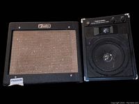 Front view of Fender tube amp and Realistic speaker side by side