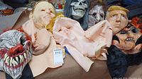 Overview image showing seven varied Halloween masks including Donald Trump mask and horror clown mask with sharp teeth