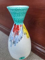 Mid Century Italian ceramic vase with colorful painted design and turquoise neck.