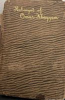 Cover of the book showing textured brown material with gold embossed title