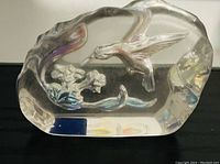 Clear glass hummingbird figurine by Tilly showing detailed raised hummingbird and floral design.