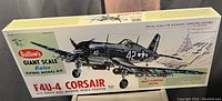 Box of Guillow's Giant Scale Balsa Flying Model Kit featuring F4U-4 Corsair model aircraft illustration and specifications