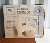 Photo of Weatherworks Oscillating Pedestal Fan box showing key features and product image